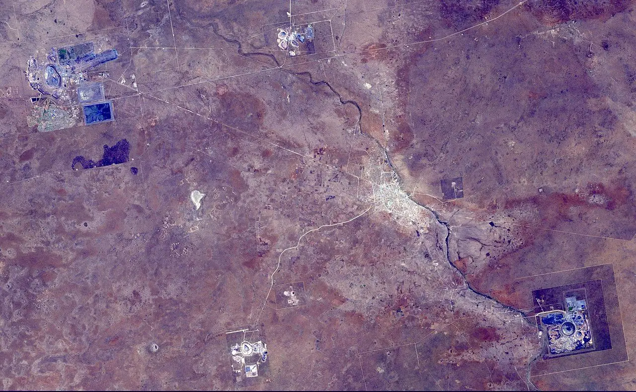 The Orapa diamond mine is the world's largest diamond mine by area. The mine is located in Botswana. It is the oldest of four mines operated by the same company, having begun operations in 1971. Orapa